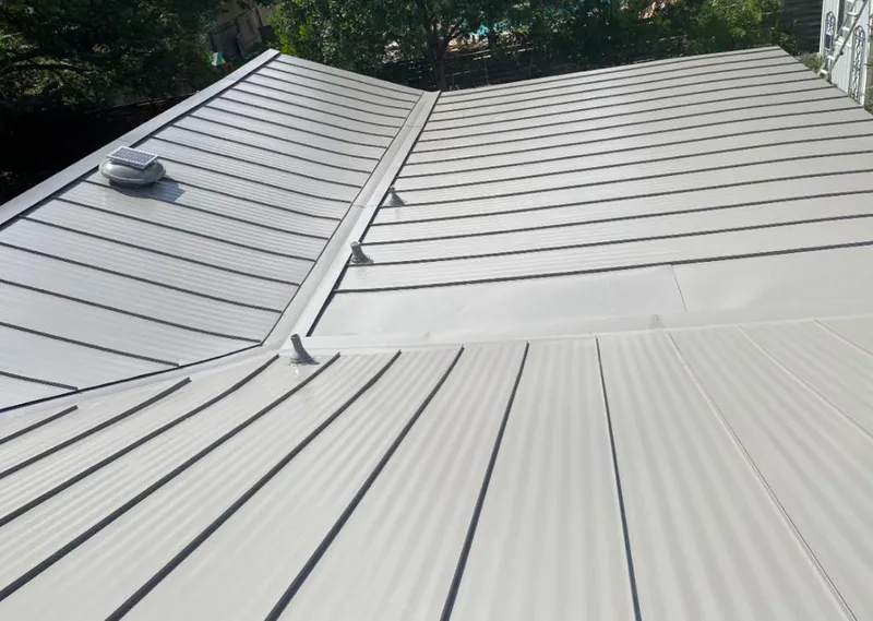 Solar attic fan installed on a metal roof for Roof Ventilation in Rockcreek